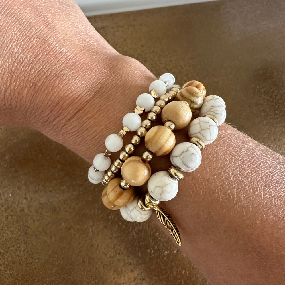 Handmade beaded bracelet set w/ gold detail and feather charm